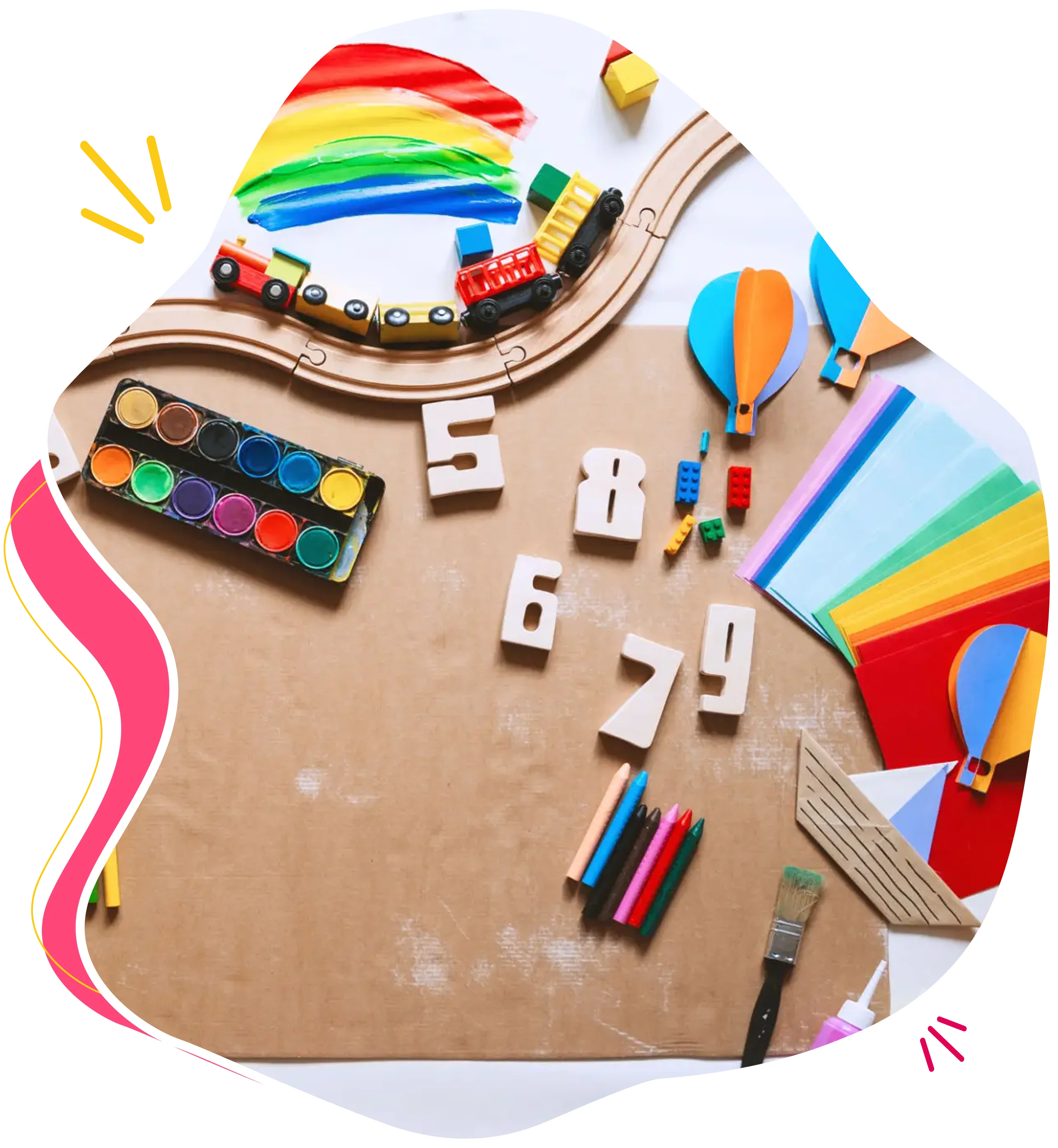 Art supplies and colorful crafts arranged on a table.